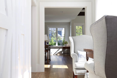 Mid-sized transitional light wood floor hallway photo in Boston with gray walls