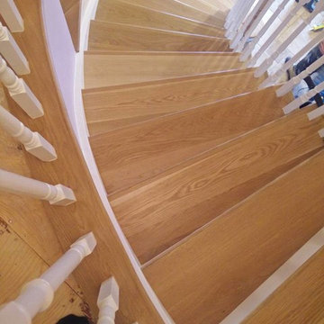 New stair tread, and refinishing spindles and rail