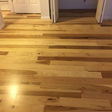 New unfinished 5" Hickory installed on two levels, sanded and finished natural