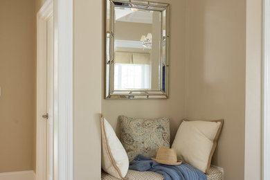 Hallway - traditional light wood floor hallway idea in Boston with beige walls