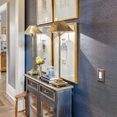 Example of a trendy medium tone wood floor hallway design in Nashville with blue walls