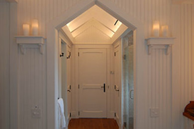 Mid-sized dark wood floor hallway photo in Dallas with white walls