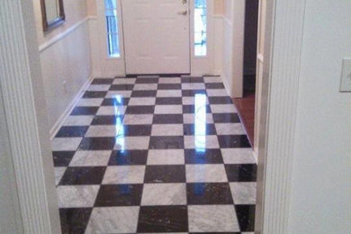 Example of a mid-sized trendy marble floor and multicolored floor hallway design in Nashville with beige walls