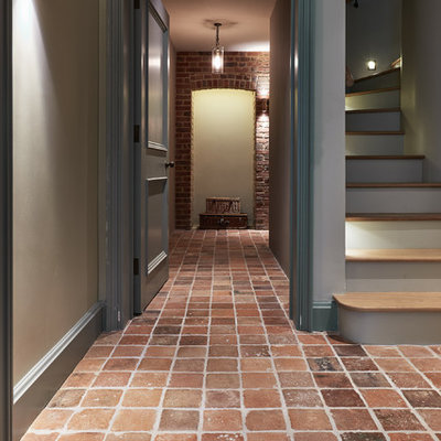 Example of a classic terra-cotta tile hallway design in Wiltshire
