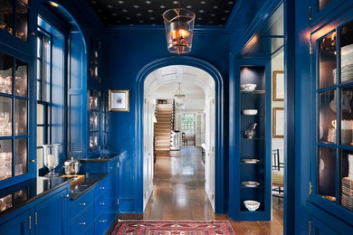 Hallway - traditional dark wood floor hallway idea in Philadelphia with blue walls