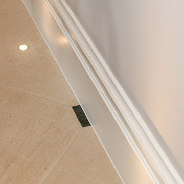 Recessed uplights in traditional stone floor