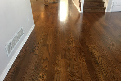 Inspiration for a medium tone wood floor and brown floor hallway remodel in Denver