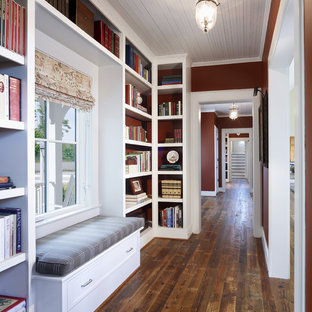Photo of a country hallway in DC Metro with red walls and dark hardwood floors.