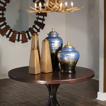 Round Bronzed, Entryway Table with Gold Antler Chandelier, and Blue Geometric Ac