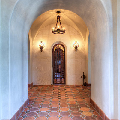 Inspiration for a mediterranean terra-cotta tile hallway remodel in Austin