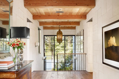 Inspiration for a contemporary dark wood floor hallway remodel in Austin with white walls