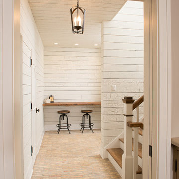 Shiplap Siding Rear Hall with Reclaimed Bench, Stair Well, and Pocet Door