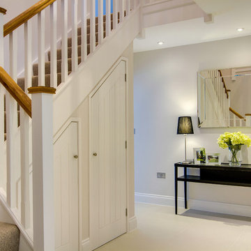 Spacious hallway finished in pale grey