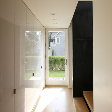 Stair Hall with White Acrylic Cabinets and Black Steel