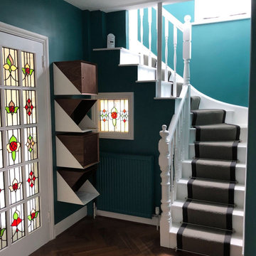 Stunning colourful bespoke stained glass door and window reviving a dark hallway