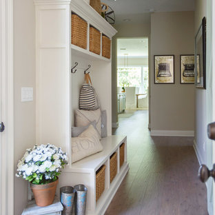 Inspiration for a mid-sized traditional hallway in Jacksonville with beige walls, medium hardwood floors and brown floor.