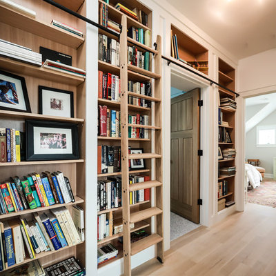 Inspiration for a transitional light wood floor and beige floor hallway remodel in Providence with white walls