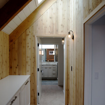 Vaulted Ceilings and Wood Wall Panels in Hallway