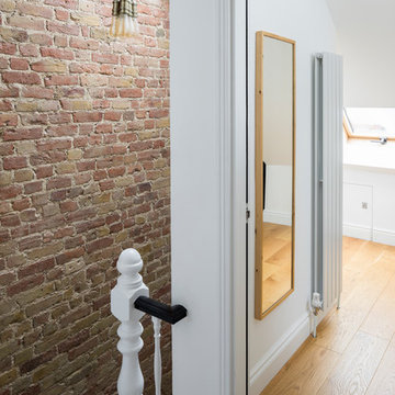 Wimbledon House - staircase with exposed brick wall