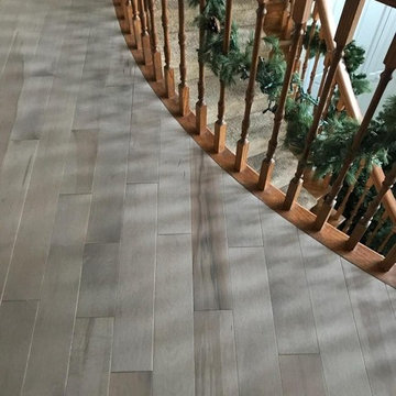 Wood Floor in Upper Hall with Curved Bannister