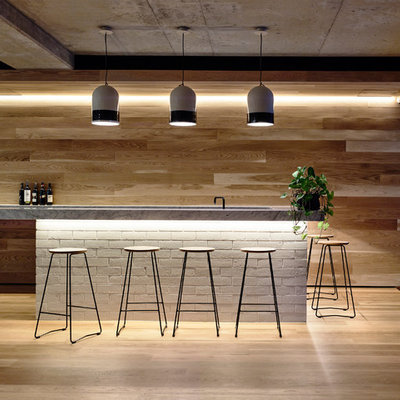 Large trendy seated home bar photo in Melbourne with marble countertops
