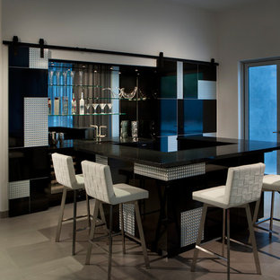 Inspiration for a contemporary u-shaped breakfast bar in Phoenix with black cabinets, mirror splashback and beige floors.