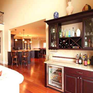 Bar Area in Living Room Coordinates with Dark Cabinets in Kitchen