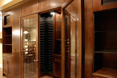 Wine cellar - traditional wine cellar idea in Calgary