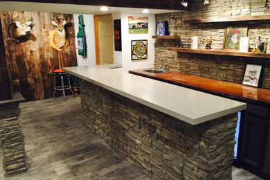 Seated home bar - mid-sized rustic single-wall porcelain tile and gray floor seated home bar idea in Philadelphia with a drop-in sink, beige backsplash, stone tile backsplash and concrete countertops