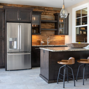 Inspiration for a rustic single-wall gray floor wet bar remodel in Minneapolis with shaker cabinets, dark wood cabinets, brown backsplash, wood backsplash and gray countertops