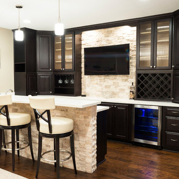 Basement Bar with Wood Flooring and Stone Wall