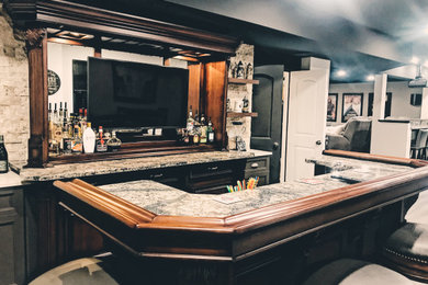 Example of a transitional home bar design in Other