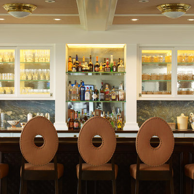 Beach style galley seated home bar photo in Los Angeles with white cabinets and gray backsplash