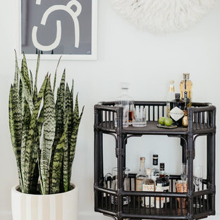 Inspiration for a beach style bar cart in Sydney with light hardwood floors and beige floor.