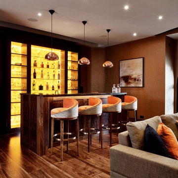 Bespoke bar design with alabaster wall display cabinet