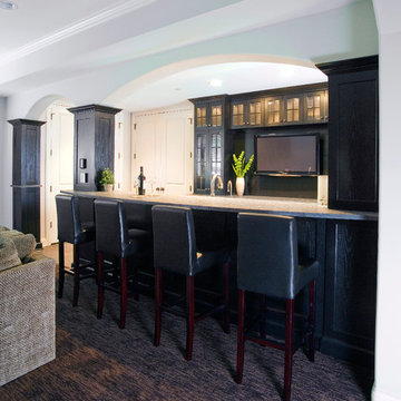 Black cabinetry with glass-fronted doors and multiple arched openings