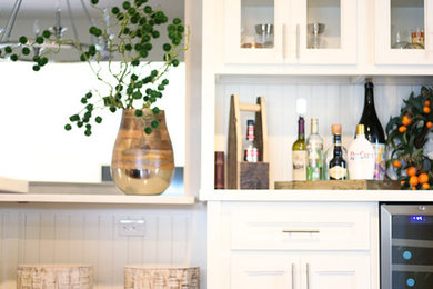 Example of a transitional home bar design in Other