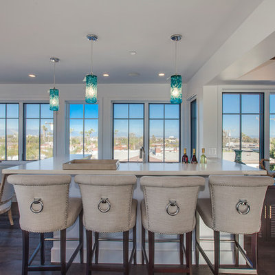 Inspiration for a coastal u-shaped dark wood floor seated home bar remodel in Los Angeles