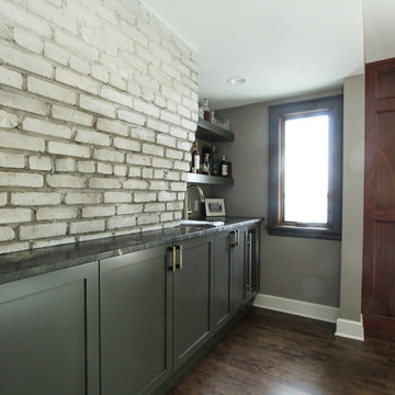 Charcoal cabinets with Exposed Brick and Sueded Granite