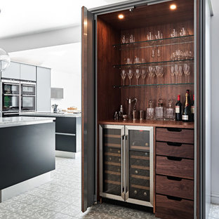 Photo of a contemporary single-wall home bar in Wiltshire with no sink, wood worktops, brown splashback, wood splashback, multi-coloured floors and brown worktops.
