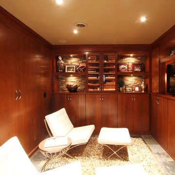Cigar Room with Wood Paneling and Cherry Cabinets and A Murphy Bed