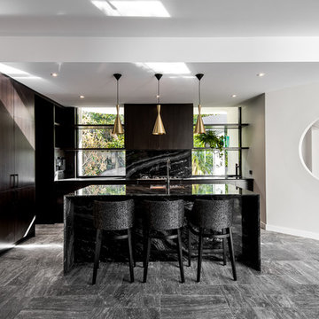 Contemporary bold kitchen with feature granite and brass pendant lighting