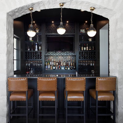 Example of a mid-sized transitional galley brown floor and dark wood floor wet bar design in Austin with an undermount sink, black cabinets, quartzite countertops, black backsplash, glass tile backsplash and brown countertops