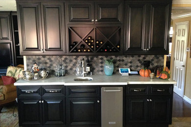 Inspiration for a contemporary single-wall slate floor wet bar remodel in Orange County with an undermount sink, dark wood cabinets, granite countertops, gray backsplash and ceramic backsplash
