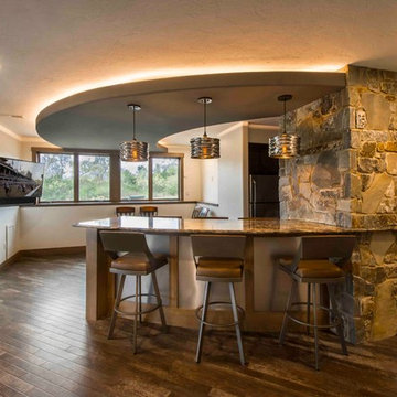 Curved Bar Seating under Curved Soffitt with Rustic Stone Accents
