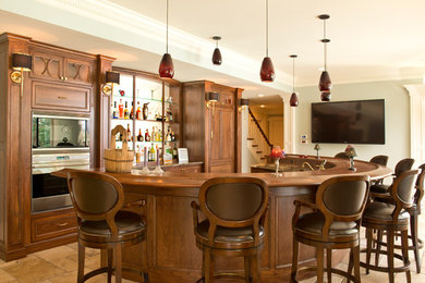 Seated home bar - traditional limestone floor seated home bar idea in Columbus with recessed-panel cabinets, dark wood cabinets, wood countertops and brown countertops