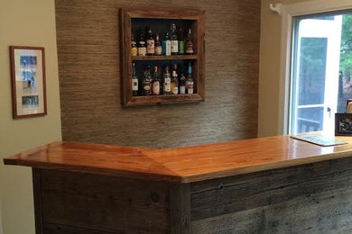 Medium sized rustic single-wall breakfast bar in Boston with medium wood cabinets, wood worktops and beige splashback.