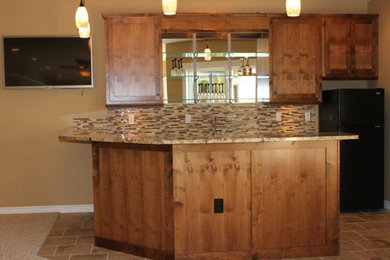 Home bar - mid-sized traditional u-shaped ceramic tile home bar idea in Denver with shaker cabinets, dark wood cabinets, granite countertops, beige backsplash and matchstick tile backsplash