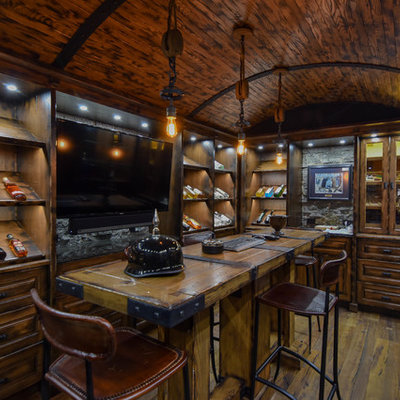 Example of a large mountain style u-shaped medium tone wood floor and brown floor seated home bar design in Edmonton with raised-panel cabinets, dark wood cabinets, wood countertops, brown backsplash, wood backsplash and brown countertops