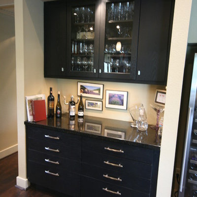 Mid-sized trendy galley dark wood floor and brown floor wet bar photo in Houston with flat-panel cabinets, granite countertops, no sink and black cabinets